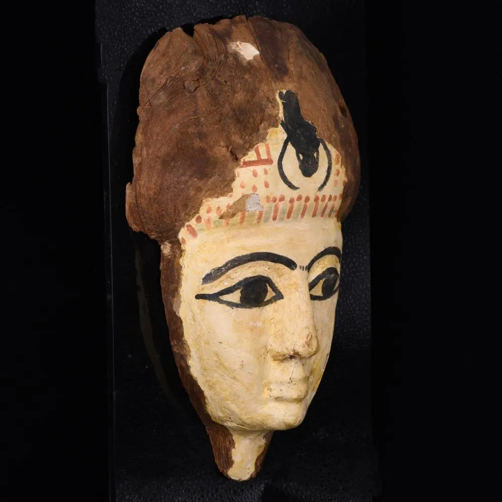 An Egyptian Wooden Mummy Mask, 21st Dynasty, ca. 1069 - 945 BCE