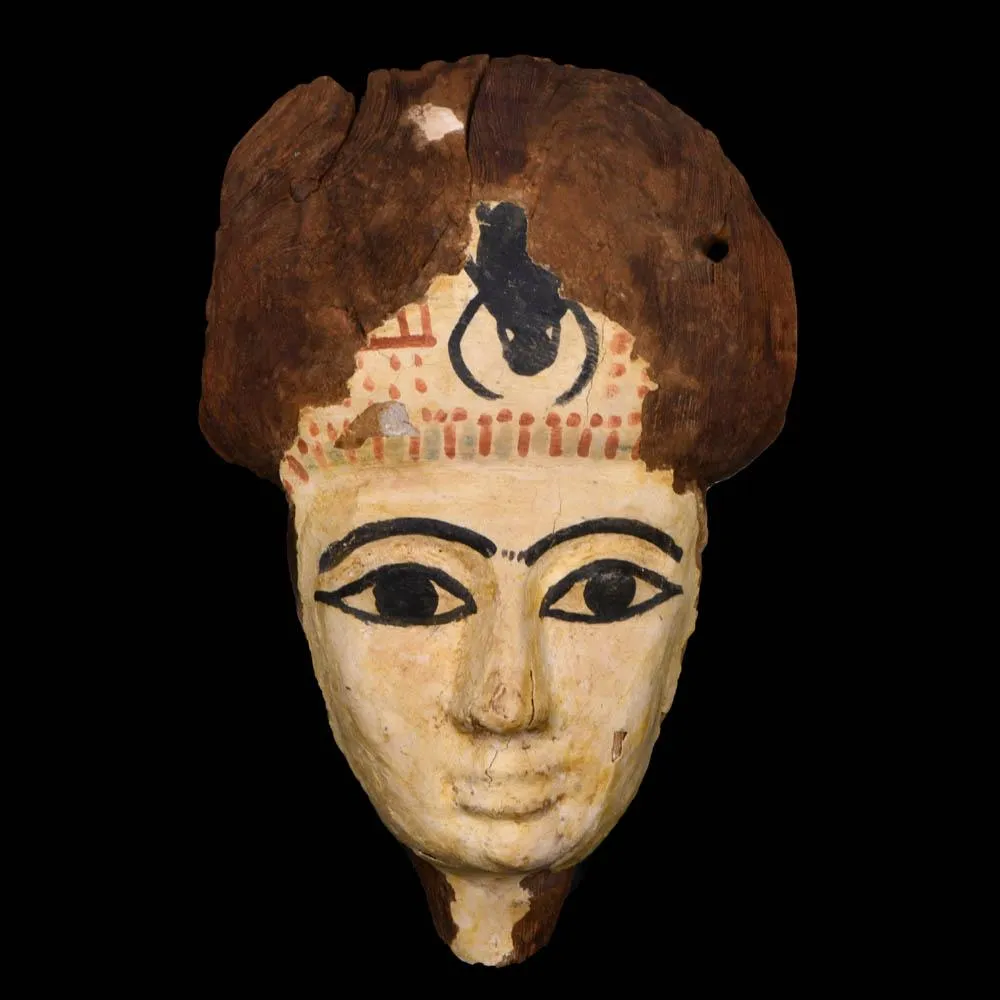 An Egyptian Wooden Mummy Mask, 21st Dynasty, ca. 1069 - 945 BCE